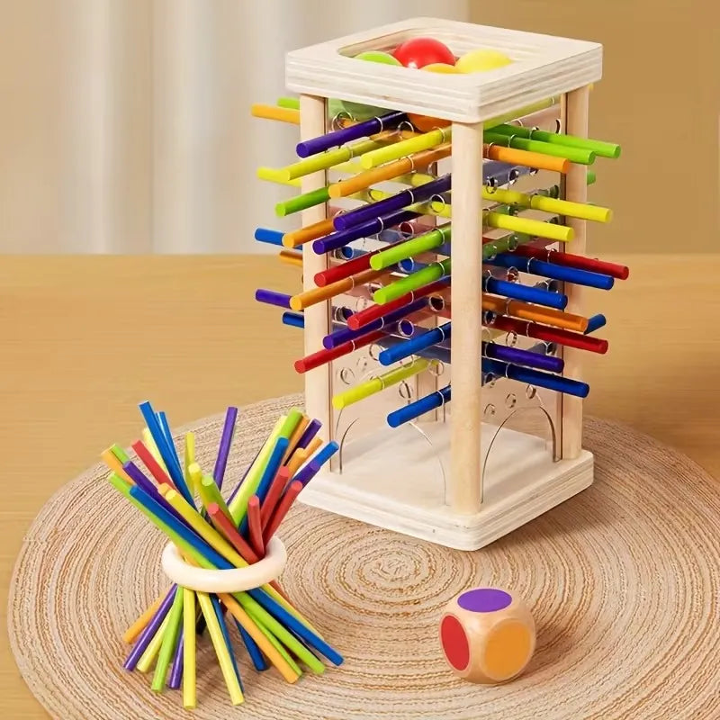 Juego de lógica torre de madera con pelotas y palitos en uso – Mil Ideas