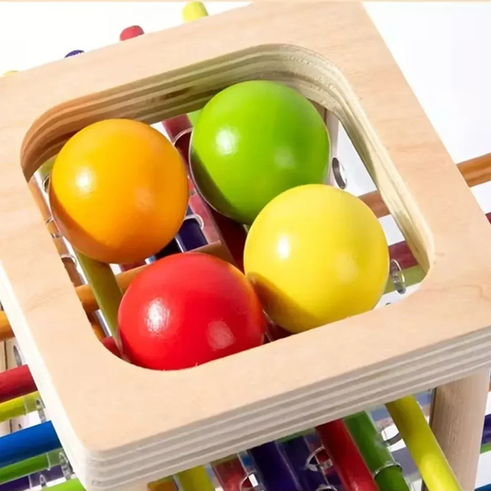 Juego de lógica torre de madera con pelotas y palitos detalle – Mil Ideas
